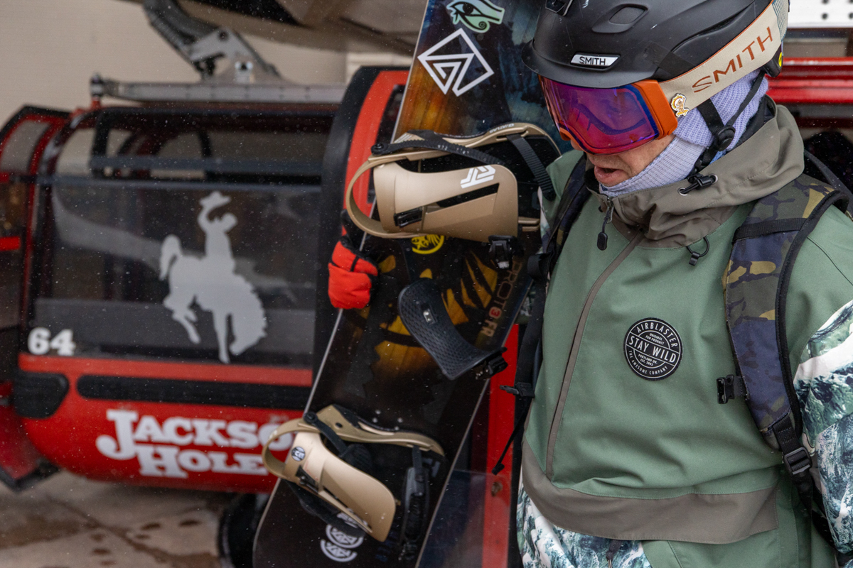 Snowboarders riding the chairlift at Jackson Hole Mountain Resort during a gear test.