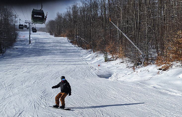 Snowboarder using Ride Snowboard Boots on Groomed Run