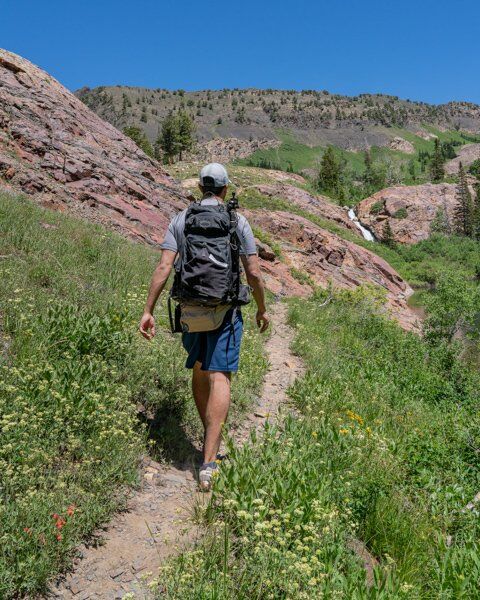 Man Hiking in Utah with Hat in Desert
