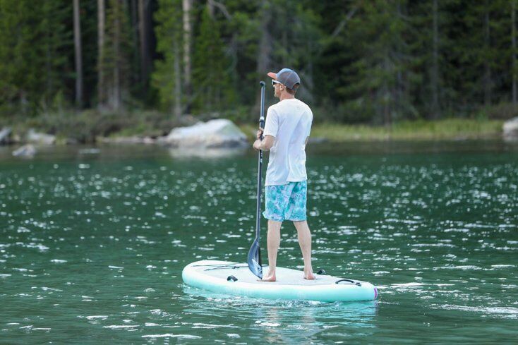 Man Paddle Boarding on String Lake in Grand Teton National Park