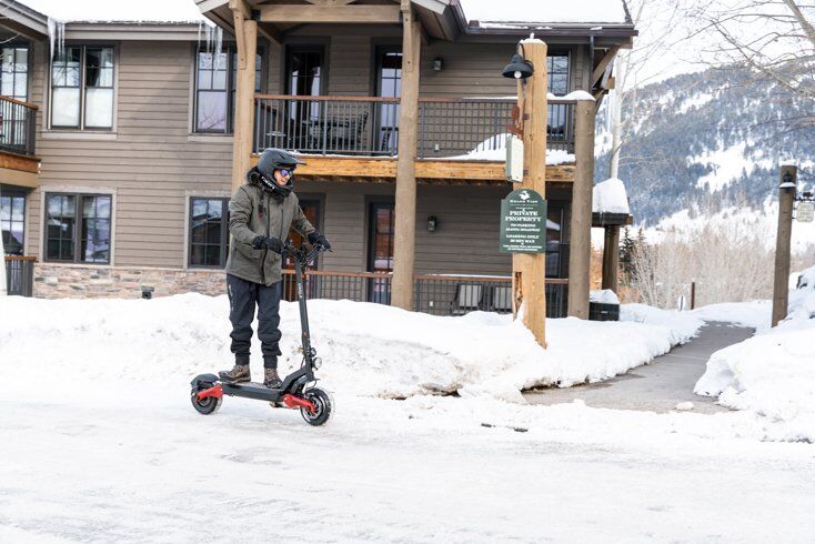 Man Commuting on E-Scooter