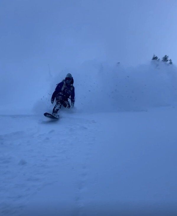 Snowboarder Ripping Powder