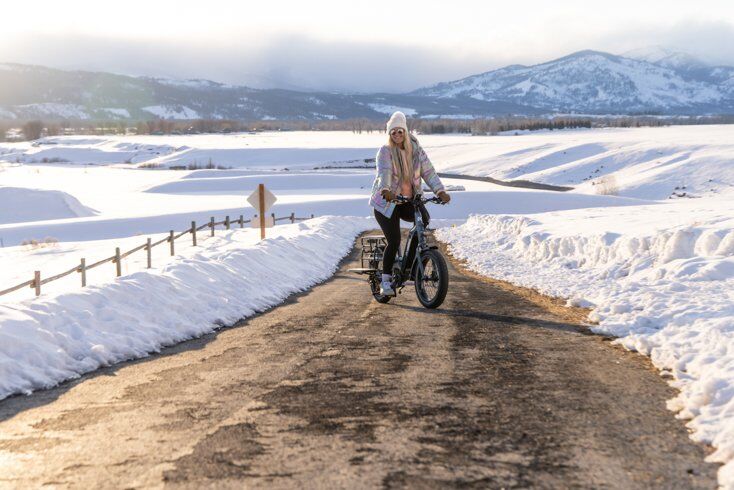 Women Wearing Shinny Jacket Riding E-Bike