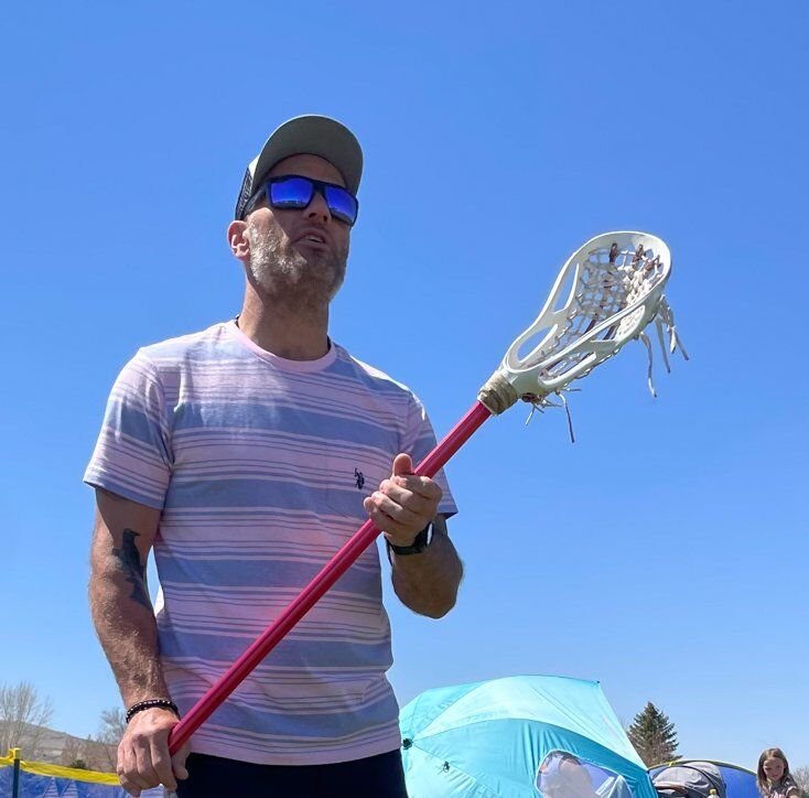 Man Playing Lacross
