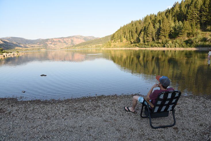 Man Sitting by Water