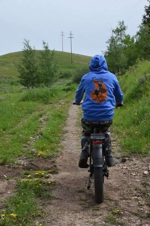 Man Riding E-Bike Uphill