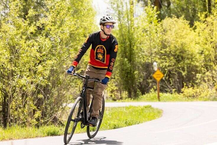 Man Riding E-Bike with Bike Jersery