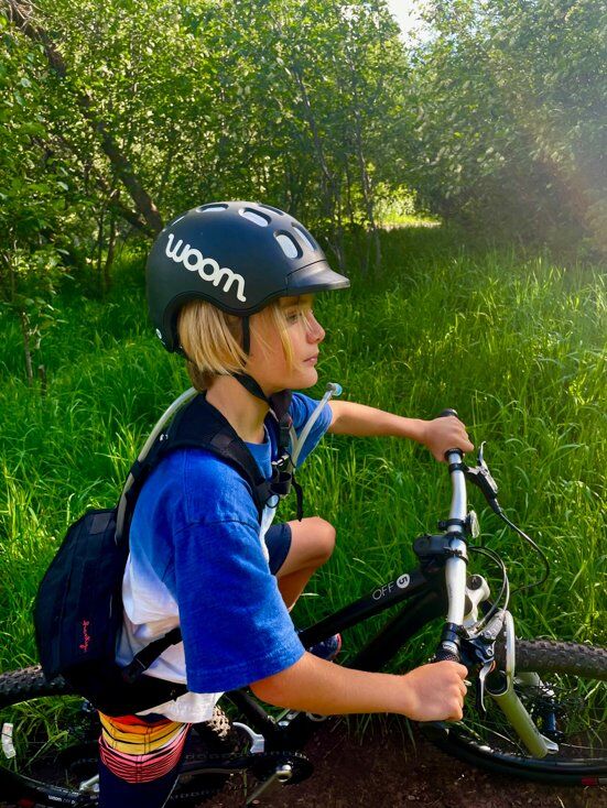 Boy Staying Hydrated While Mountain Biking