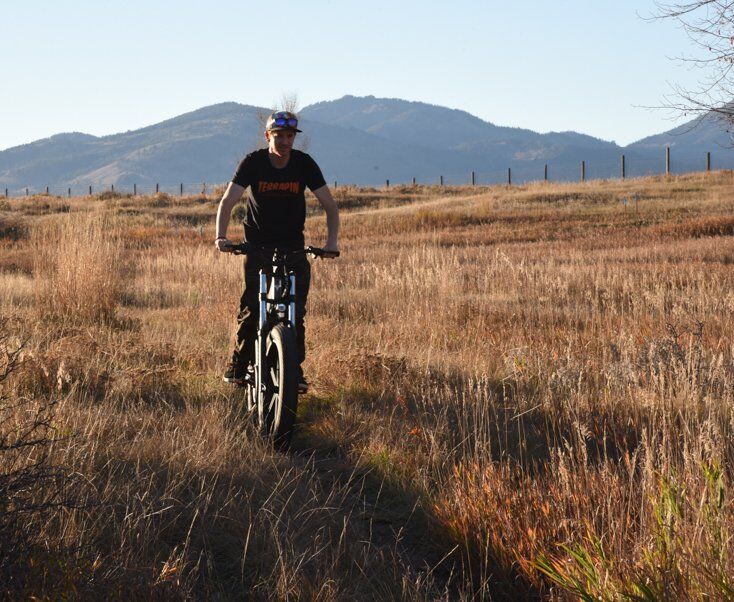 Man Riding E-Bike in Fall