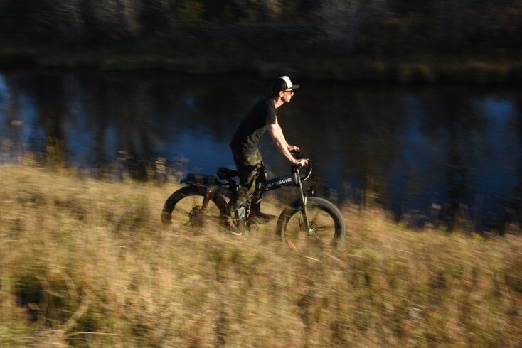 Man Riding E-Bike Downhill