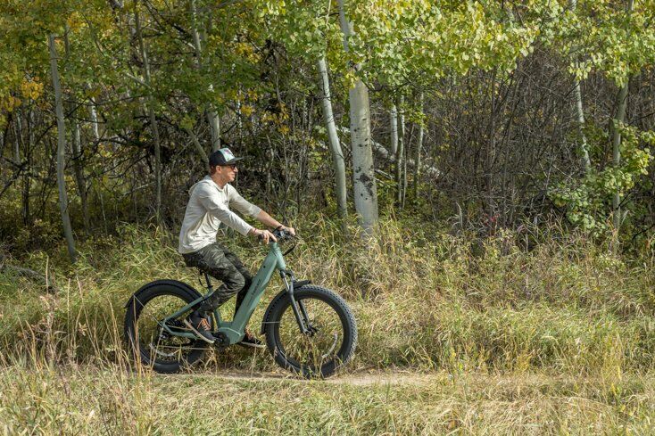 Man Riding E-Bike in Fall