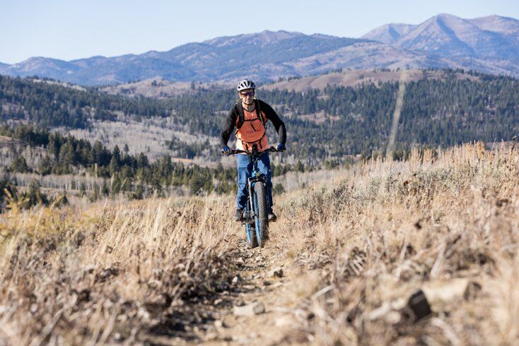 Man Riding Uphill on E-Bike