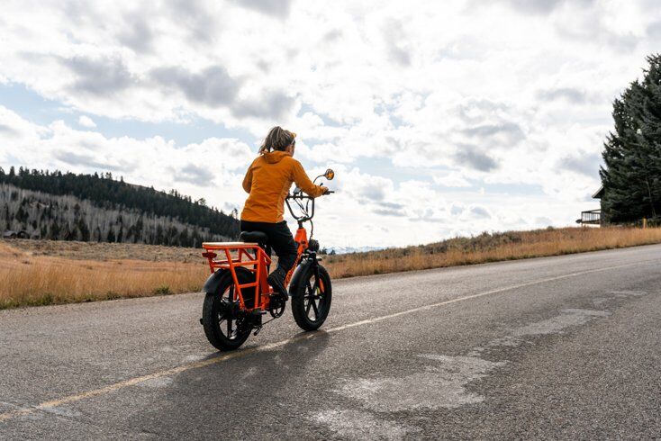 Women Riding Kingbull Voyager E-Bike Off into the Distance