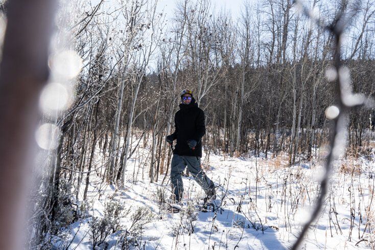 Man Walking With Faber Mountain Master Snowshoes