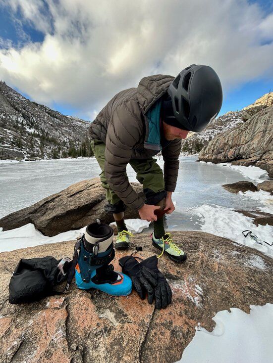 Man Putting on Ski Socks