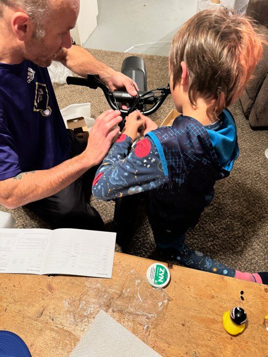 Dad and Son Putting E-Bike Together