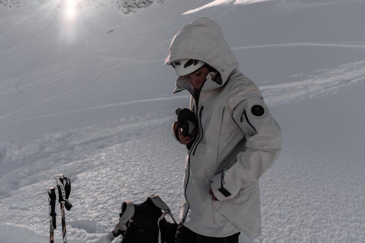 Women Wearing Ski Jacket White with White Snow