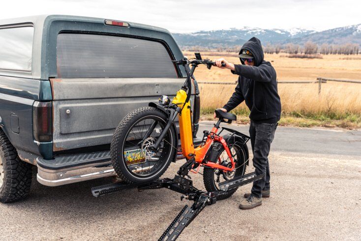 Man Putting E-Bike on Rack
