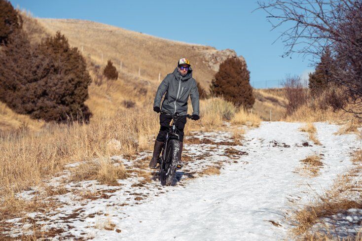 Man Riding E-Bike on Snow Trails