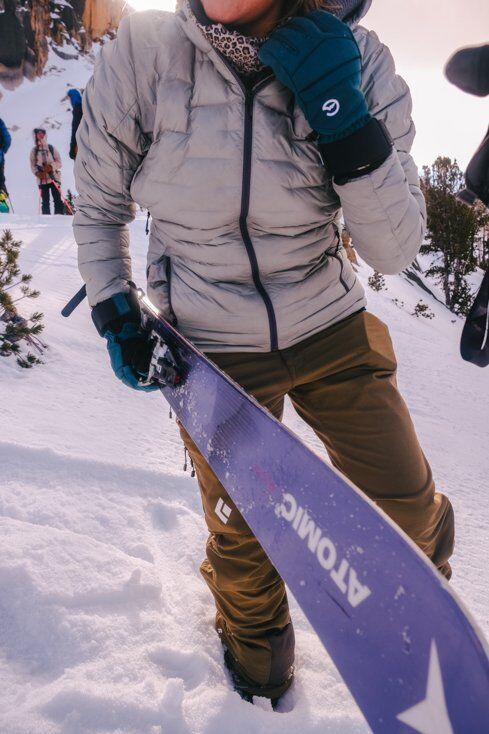 Women Carrying Skis with Gloves on 