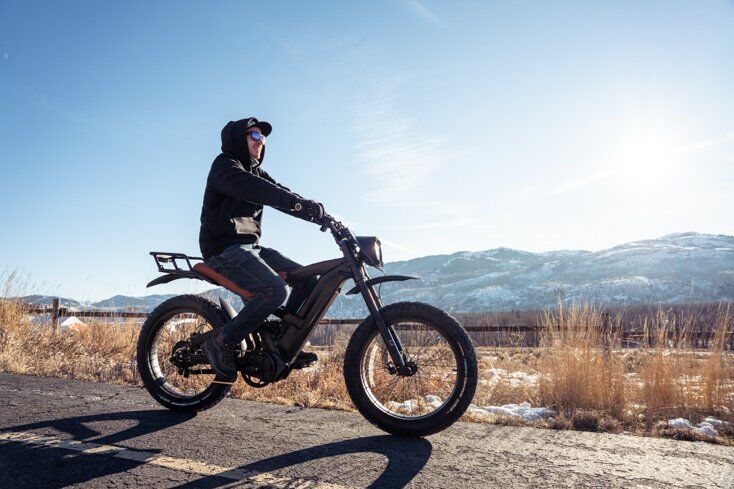 Man Riding QuietKat Lynx on Pathway