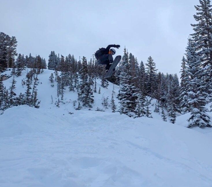 Ezra Neilson Catching Air on Snowboard