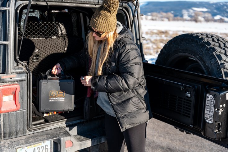Women with Powerbox in Jeep