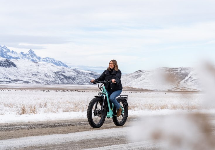 Women Riding E-Bike on Road