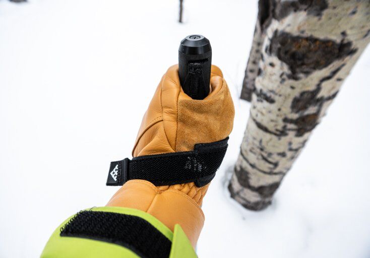 Man Holding Ski Pole with Strap