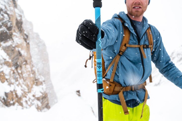 Man Easily Holding Ski Poles