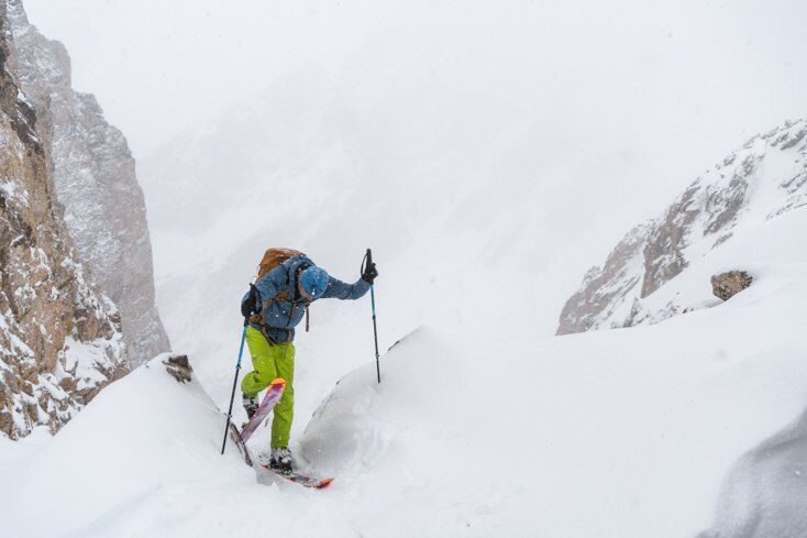 Man Ski Touring in Big Mountain Terrain