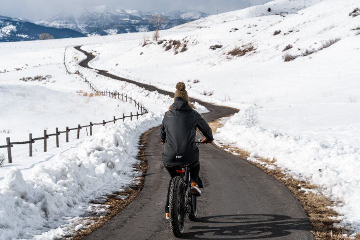 Women Riding E-Bike on Empty Pathways