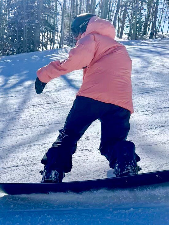 Man Making Toeside Snowboard Turn