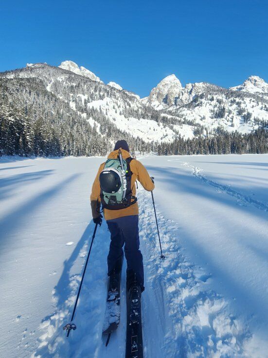 Man Splitboard Touring with Ortovox Backpack