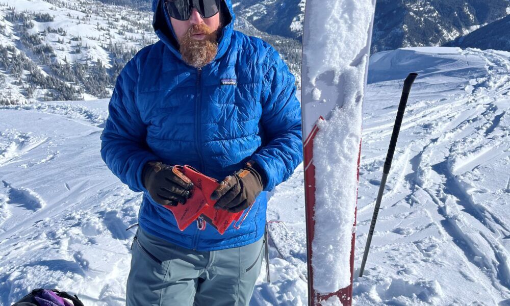 Patagonia Men’s Micro Puff Hoody Review Man Wearing Patagoinia Blue Puffy in Wintertime