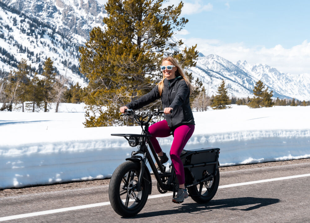 Women Riding E-Bike on Sunny Day