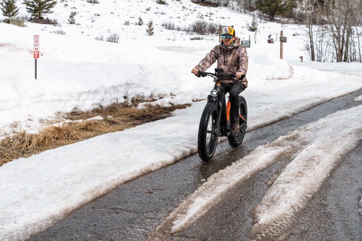 Man Riding E-Bike on Pavement
