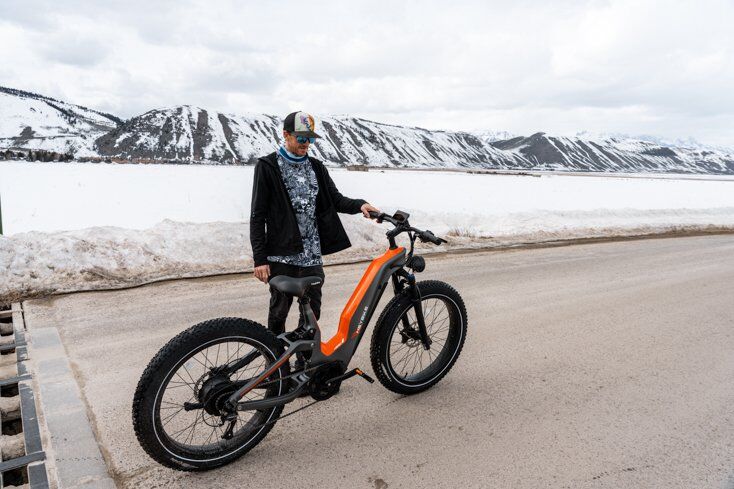 Man Standing next to Heybike HERO E-Bike