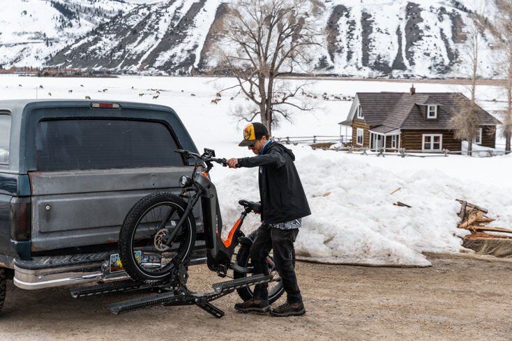 Man Unloading Heavy E-Bike