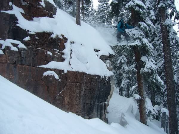 Mike Hardaker Jumping Off Huge Cliff in East Vail on His Snowboard