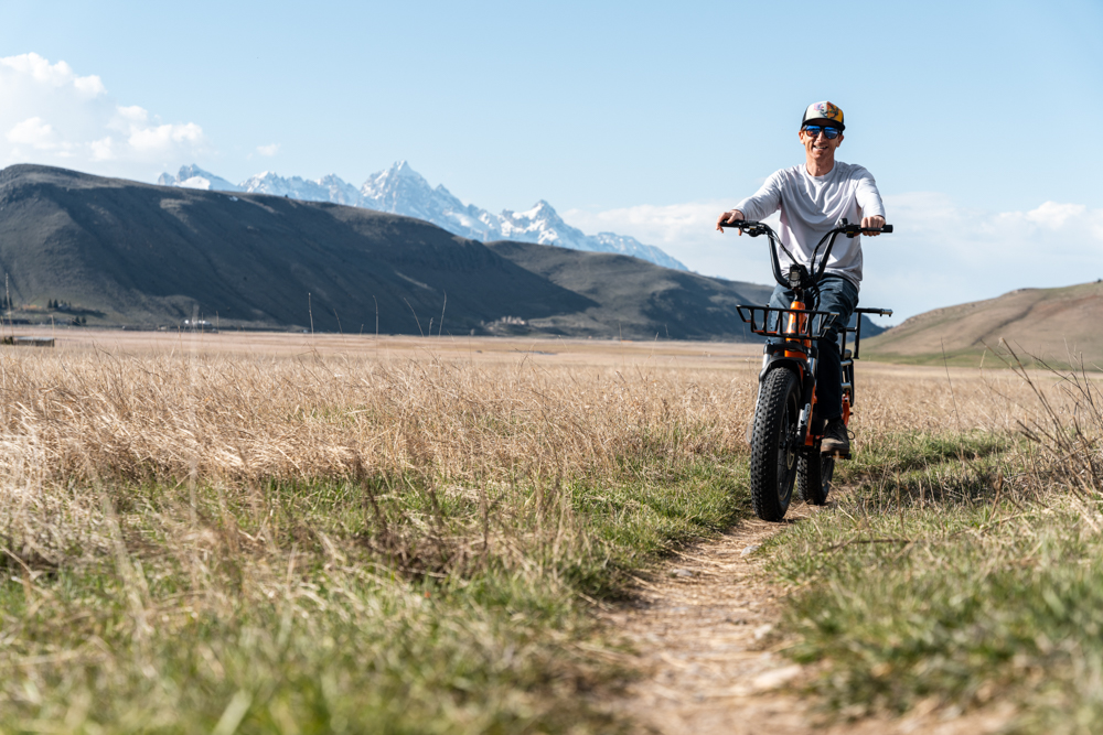 Man Riding E-Bike on Dirt Trail