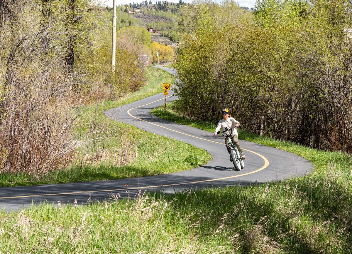 Man Riding E-Bike at Top Speed