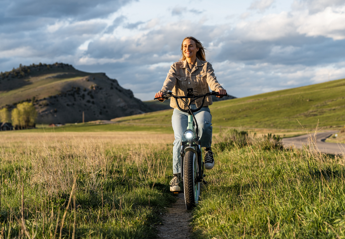 Women Riding E-Bike with Front Headlight