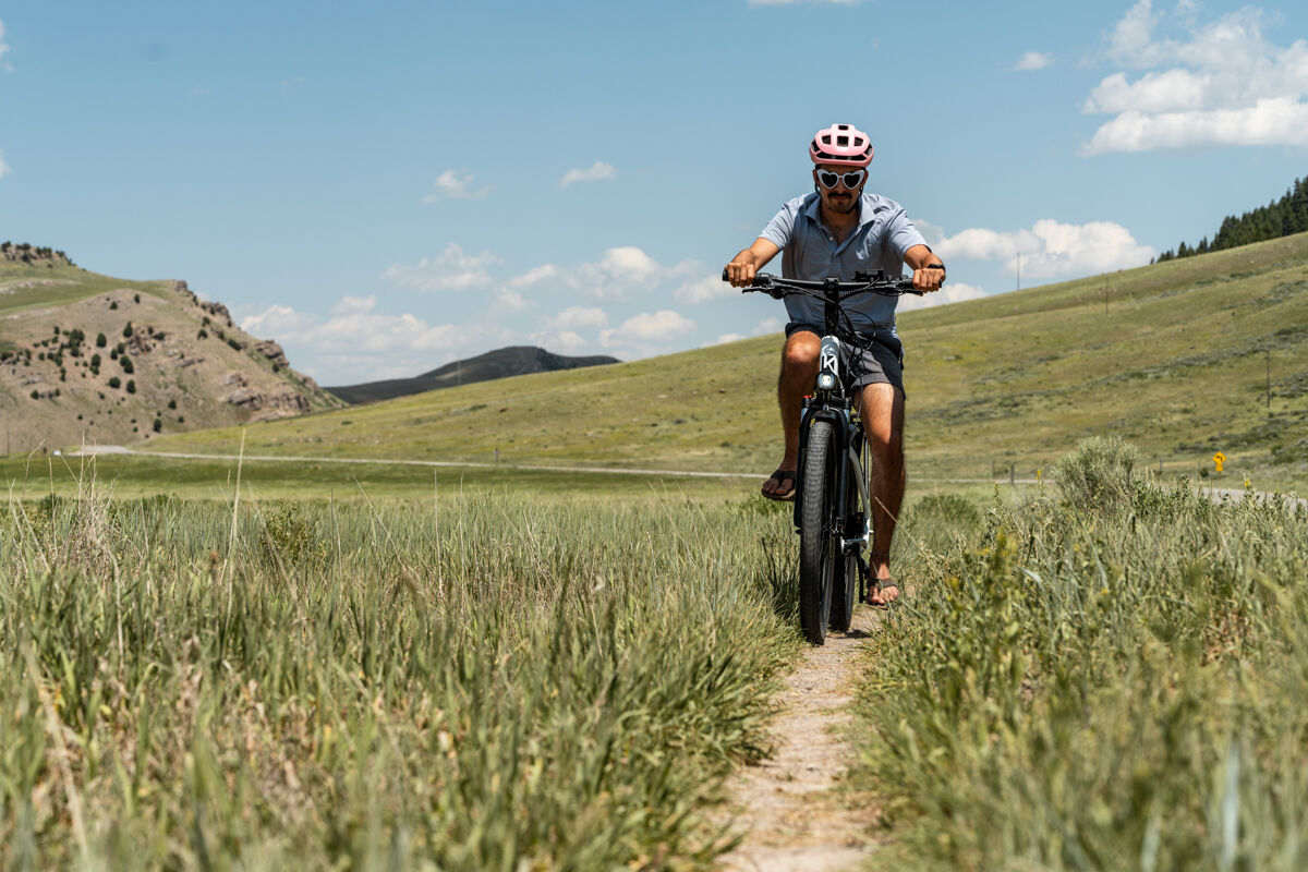 Man Riding E-Bike on Dirt Trail