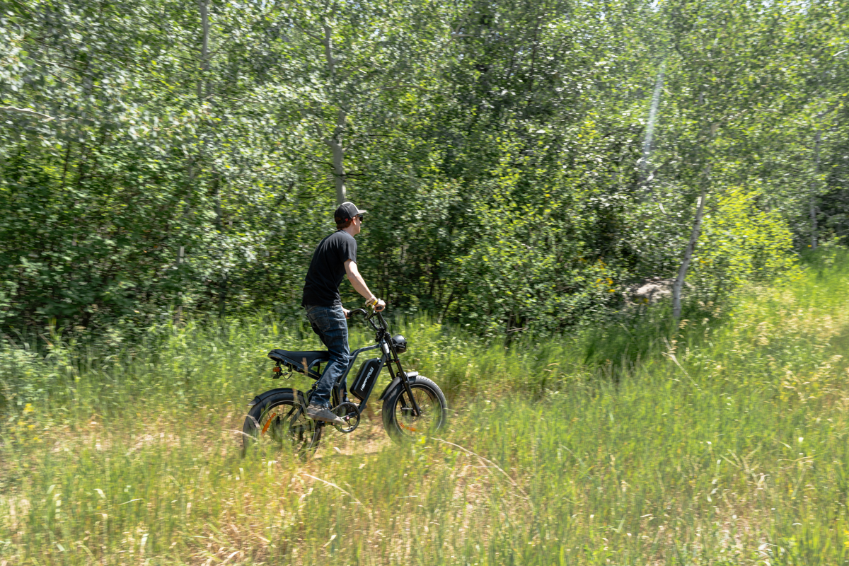 Man Riding E-Bike Through Woods