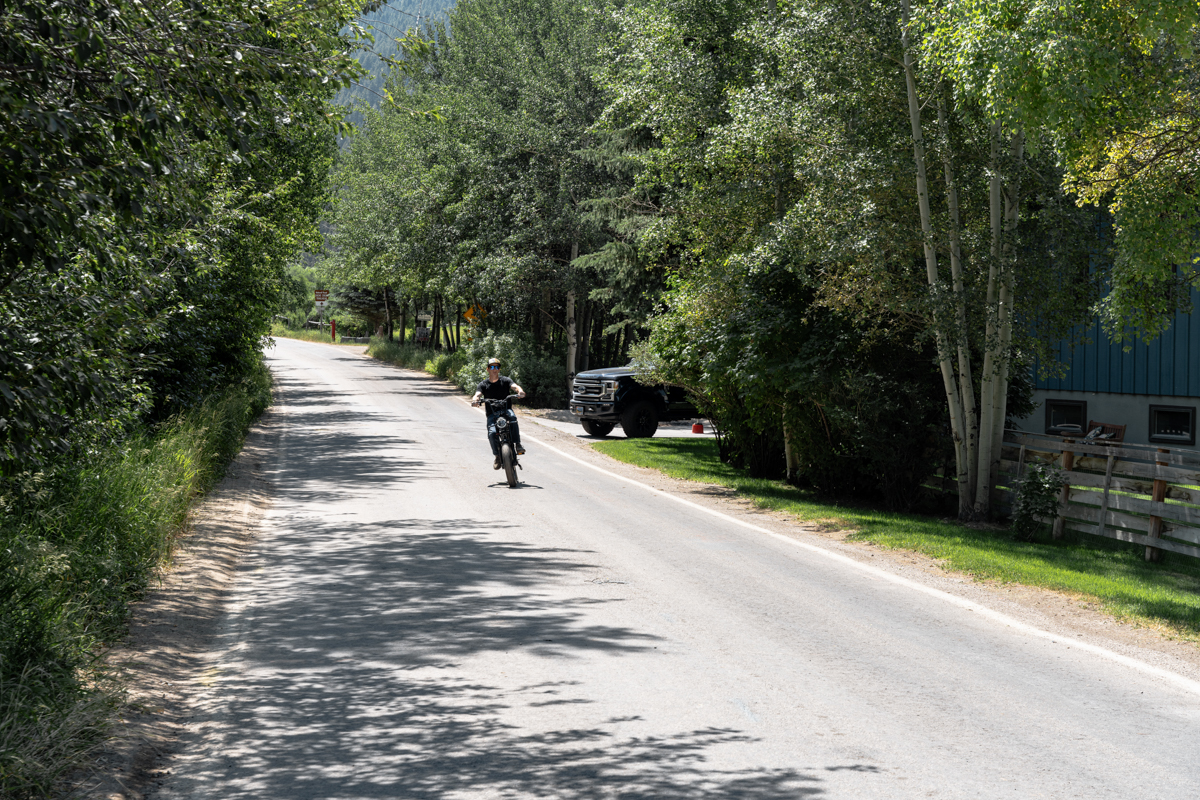 Man Riding E-Bike on Street