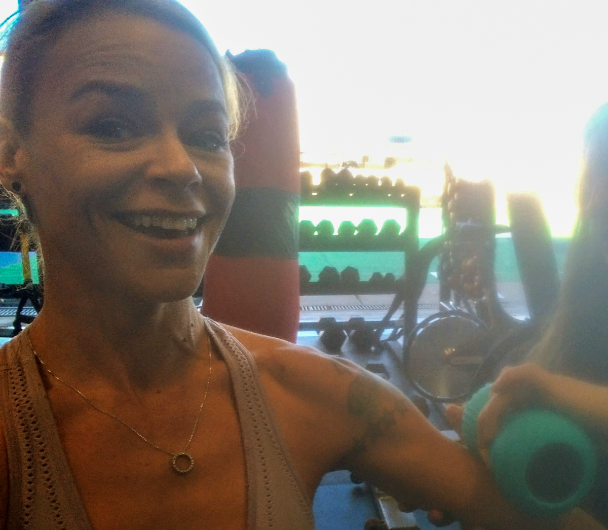 Women Using Massager at Gym