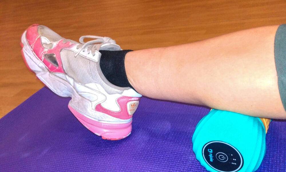 Proto Vibrating Peanut Massager Review Women Using Massager on Back of Legs
