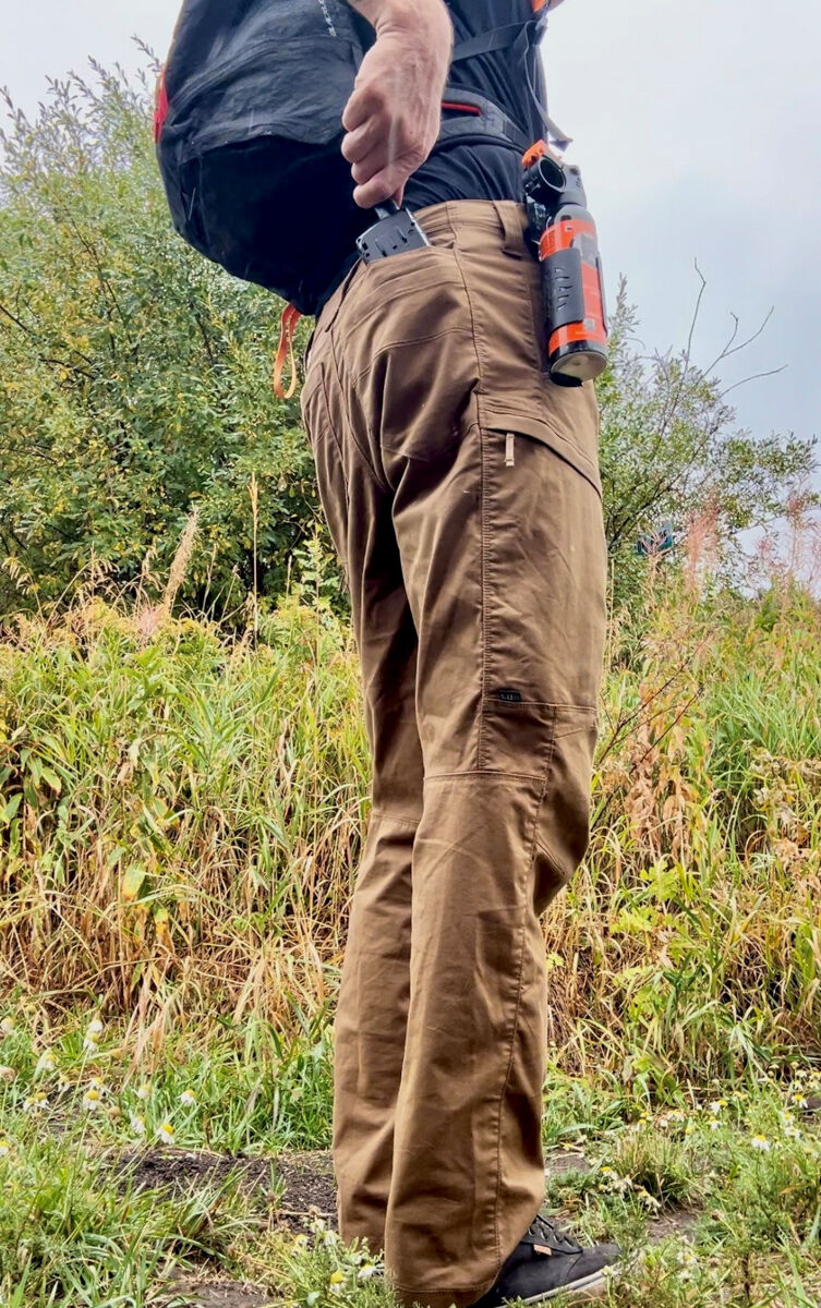Man Hiking with Bear Spray Using 5.11 Apex Technical Pants for Men