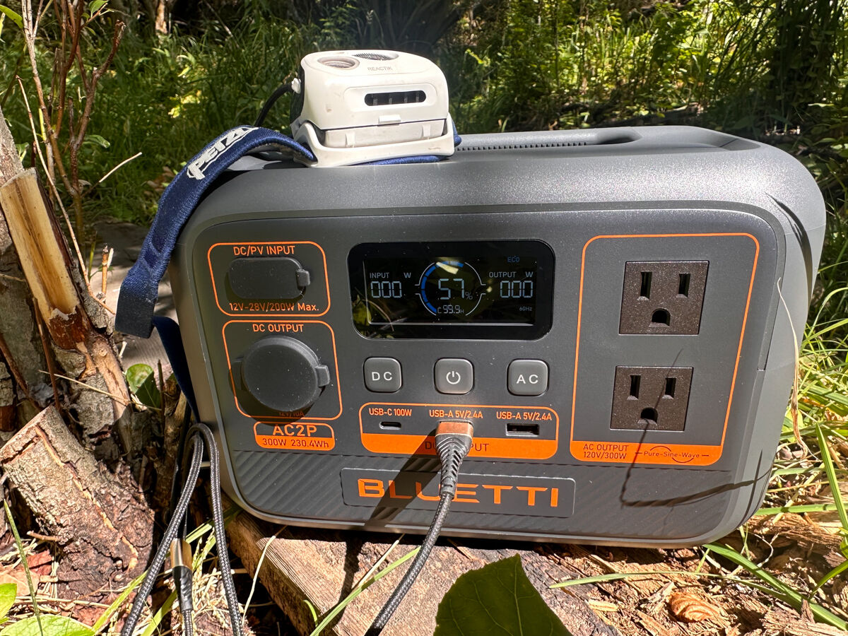 Portable Power Station While Camping Charging Headlamp